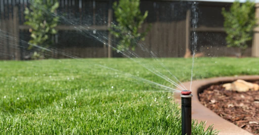 Sprinkler system watering a lawn