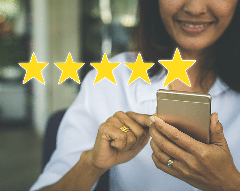 Woman giving five-star rating on her mobile